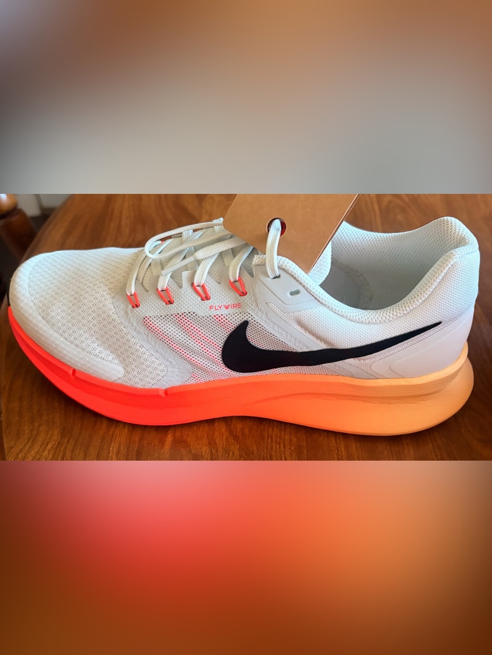 Men’s Nike Run Swift 3 White Athletic Shoe with Neon Orange Accents